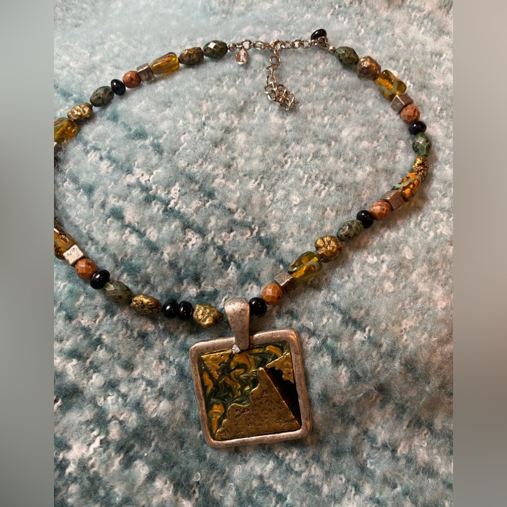 Chico’s chunky charm on earth tone gems/beads!